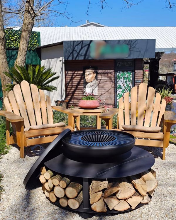 Fumolio Fuji fire pit with grill in a modern outdoor patio setting