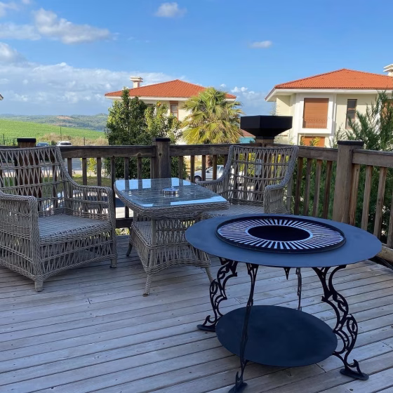 Fumolio Mayon fire pit in natural setting – premium outdoor fireplace for BBQ and garden ambiance