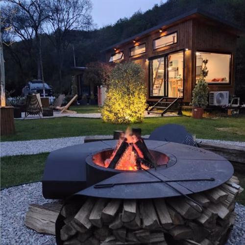 Night photo of Maria fire pit used for luxury fireplace ambiance