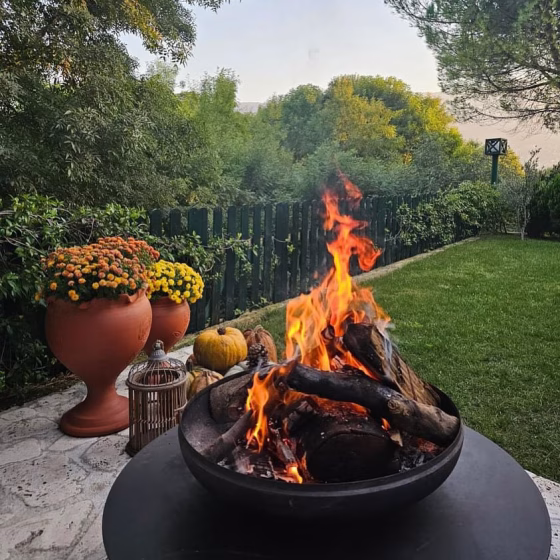 Fumolio Fuji fire pit during evening with glowing embers