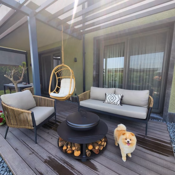 Outdoor BBQ scene featuring Fumolio Fuji fire pit in garden setup