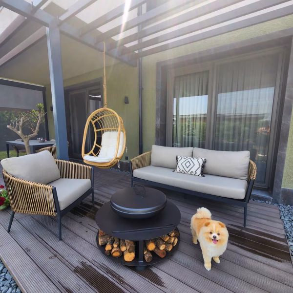 Outdoor BBQ scene featuring Fumolio Fuji fire pit in garden setup