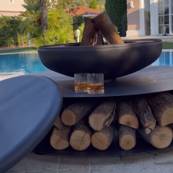 Fumolio Fuji fire pit with grill by the garden pool – luxury fireplace for patio and BBQ lovers