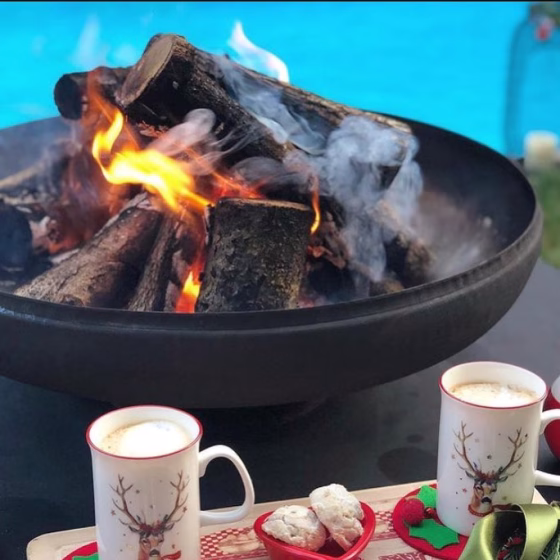 Stylish outdoor fire pit scene with Fuji and patio furniture