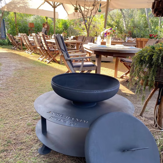 Fumolio Fuji Fire Pit used in a cozy boutique terrace setting