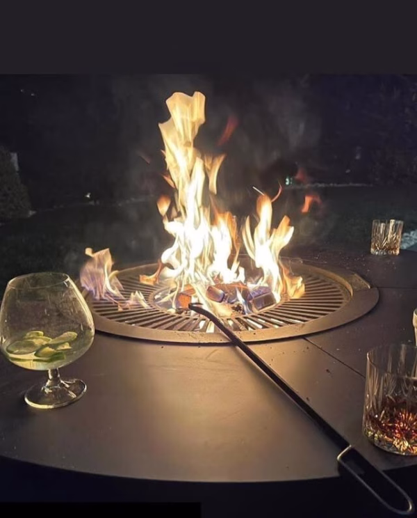 Fumolio Maria handmade steel fire pit in luxury patio setting